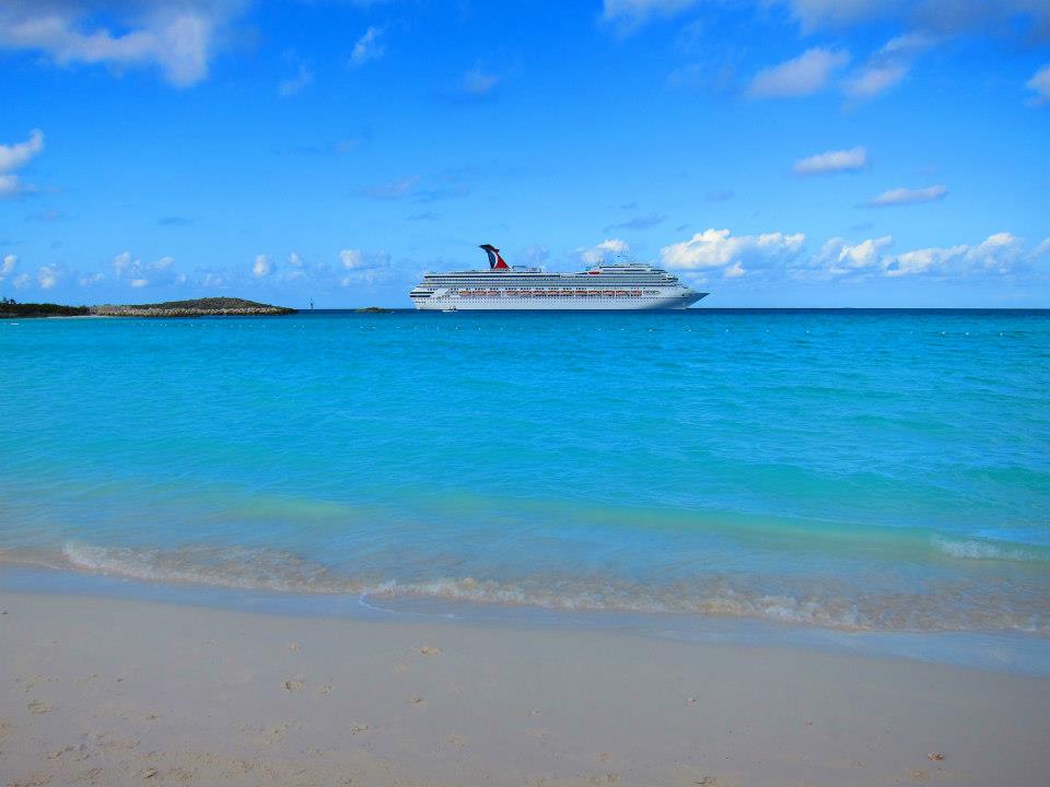 View from beach with Carnival cruise ship docked at Half Moon Cay, Bahamas