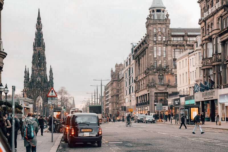 Black taxis parked along Princes Street in Edinburgh, Scotland