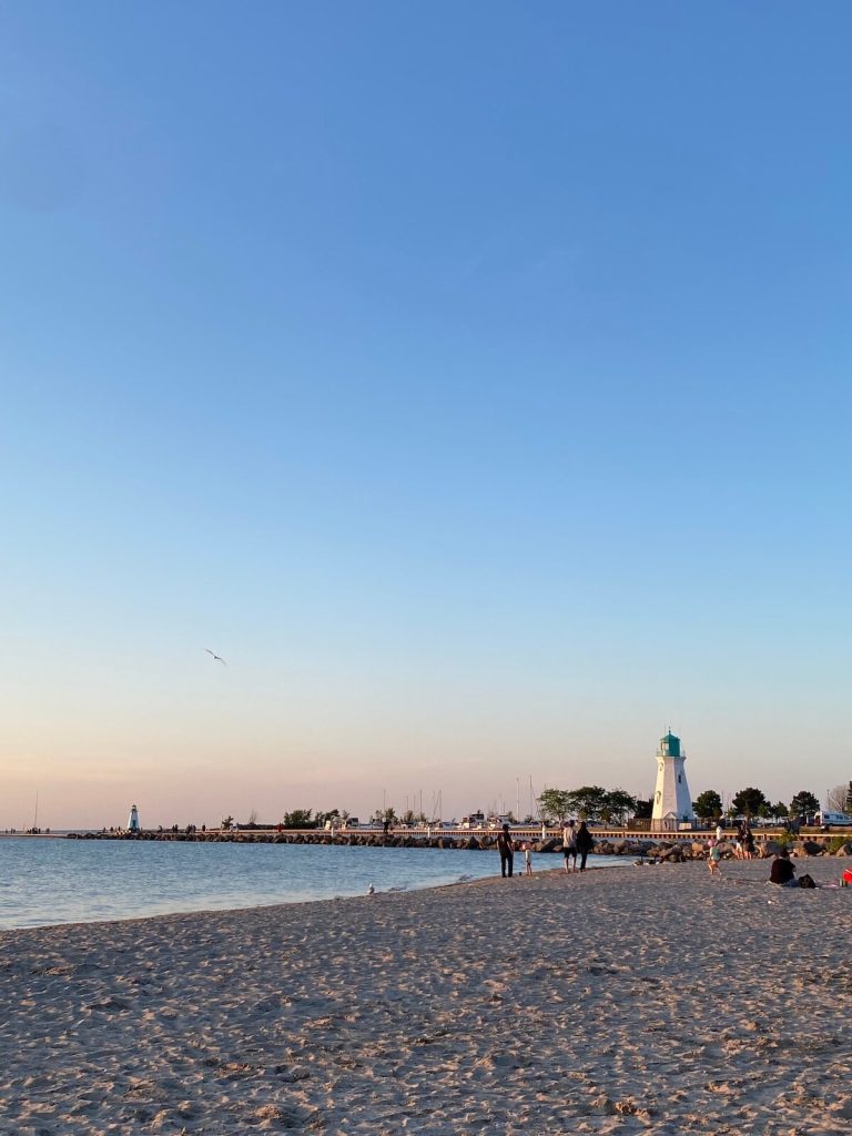 Beach and lighthouse in the distance, Port Dalhousie, Ontario