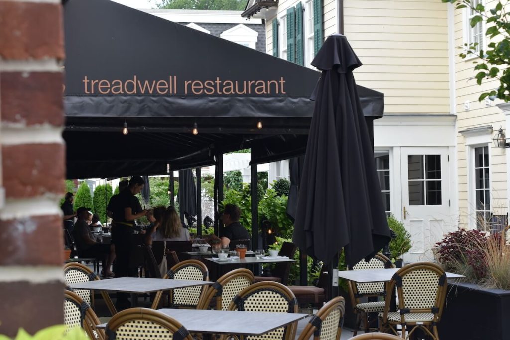 People sitting on the patio at Treadwell restaurant in Niagara-on-the-Lake
